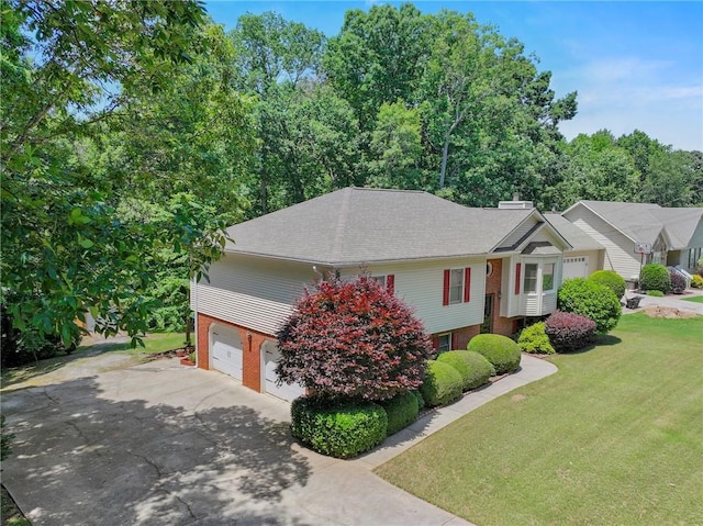 4654 Fox Forrest Dr, Flowery Branch, GA 30542 - view of front of property featuring a front yard, driveway, brick siding, and a garage