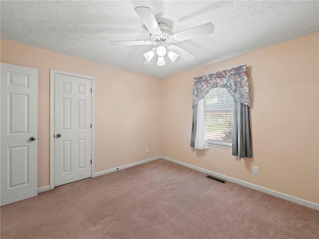 4654 Fox Forrest Dr, Flowery Branch, GA 30542 - unfurnished bedroom with carpet flooring, a textured ceiling, baseboards, and a ceiling fan