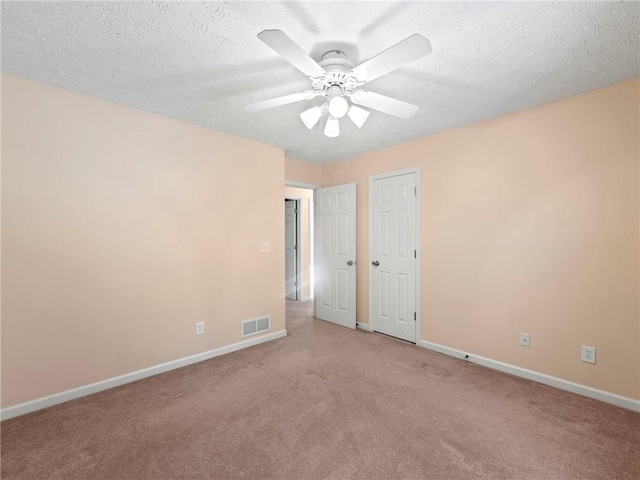 4654 Fox Forrest Dr, Flowery Branch, GA 30542 - unfurnished bedroom with baseboards, light carpet, a textured ceiling, and ceiling fan