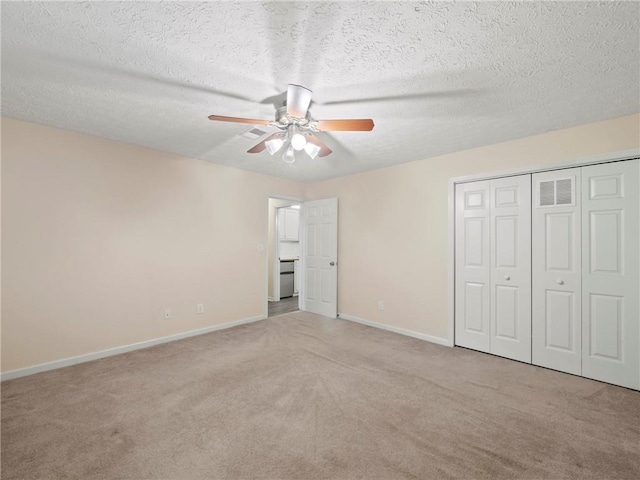 4654 Fox Forrest Dr, Flowery Branch, GA 30542 - unfurnished bedroom featuring carpet, baseboards, a textured ceiling, a ceiling fan, and a closet