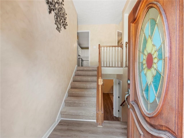 4654 Fox Forrest Dr, Flowery Branch, GA 30542 - stairway featuring baseboards and wood finished floors
