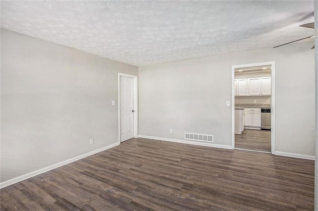 637 Carlouetta Rd SW, Mableton, GA 30126 - unfurnished room featuring dark wood finished floors and a textured ceiling