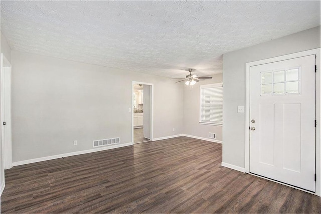 637 Carlouetta Rd SW, Mableton, GA 30126 - foyer with dark wood-style floors, ceiling fan, and a textured ceiling