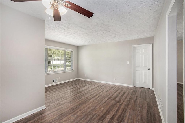 637 Carlouetta Rd SW, Mableton, GA 30126 - unfurnished room with ceiling fan, dark wood-type flooring, and a textured ceiling