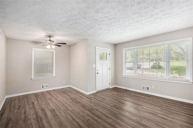 637 Carlouetta Rd SW, Mableton, GA 30126 - empty room featuring dark wood-style floors, ceiling fan, and a textured ceiling