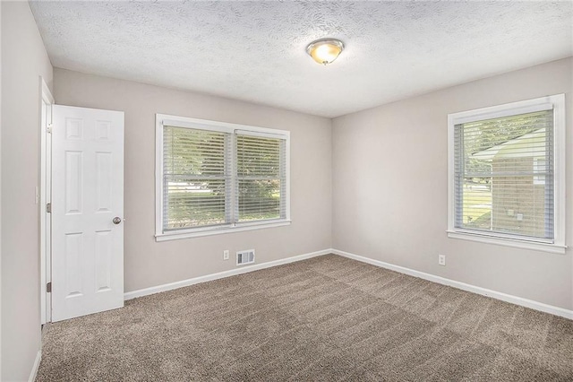 637 Carlouetta Rd SW, Mableton, GA 30126 - carpeted empty room featuring baseboards and a textured ceiling