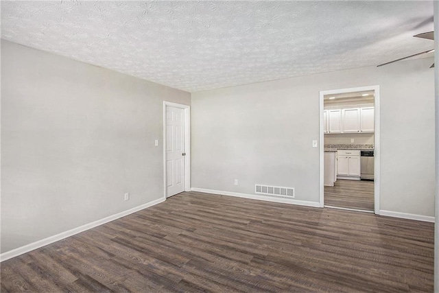 637 Carlouetta Rd SW, Mableton, GA 30126 - unfurnished room with dark wood-style floors and a textured ceiling