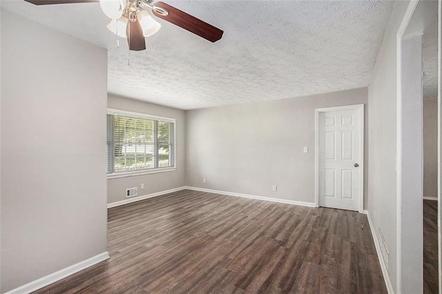 637 Carlouetta Rd SW, Mableton, GA 30126 - unfurnished room featuring dark wood-style floors, a ceiling fan, and a textured ceiling