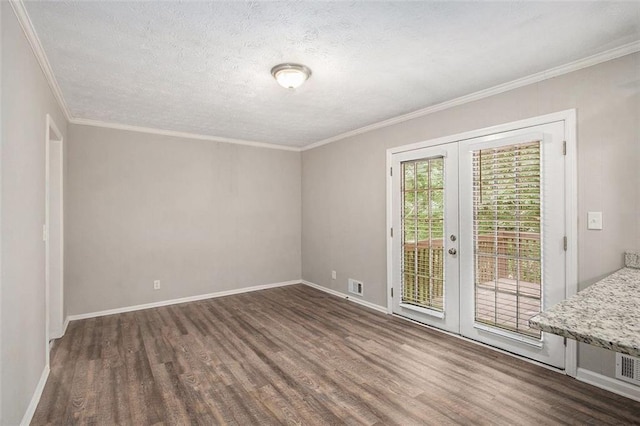 637 Carlouetta Rd SW, Mableton, GA 30126 - spare room featuring wood finished floors, french doors, ornamental molding, and a textured ceiling
