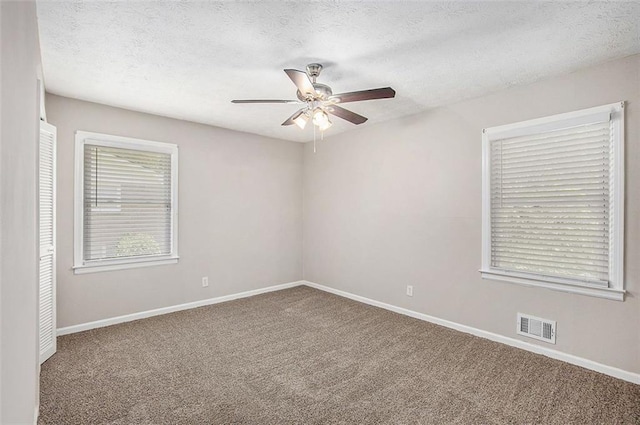 637 Carlouetta Rd SW, Mableton, GA 30126 - carpeted empty room with a ceiling fan and a textured ceiling