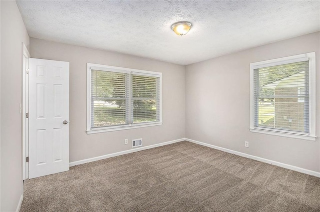 637 Carlouetta Rd SW, Mableton, GA 30126 - carpeted spare room featuring healthy amount of natural light and a textured ceiling