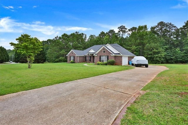 ranch-style house featuring concrete driveway and a front yard