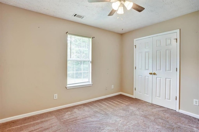501 Barhams Ridge Dr, Mcdonough, GA 30252 - unfurnished bedroom featuring baseboards, visible vents, a ceiling fan, a closet, and carpet floors