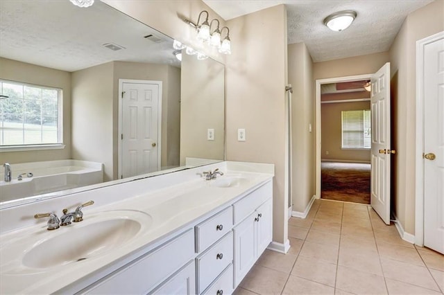 501 Barhams Ridge Dr, Mcdonough, GA 30252 - full bathroom featuring tile patterned flooring, a sink, and a textured ceiling