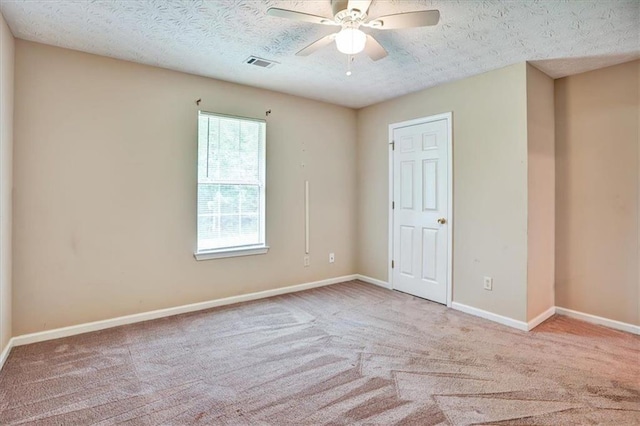 501 Barhams Ridge Dr, Mcdonough, GA 30252 - unfurnished bedroom featuring carpet floors, visible vents, and a textured ceiling
