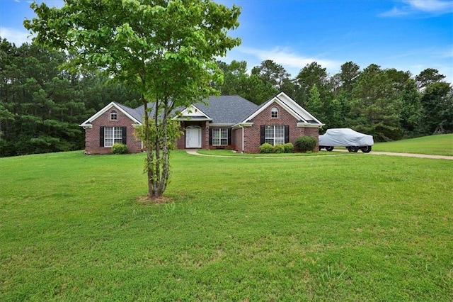 single story home with brick siding and a front yard