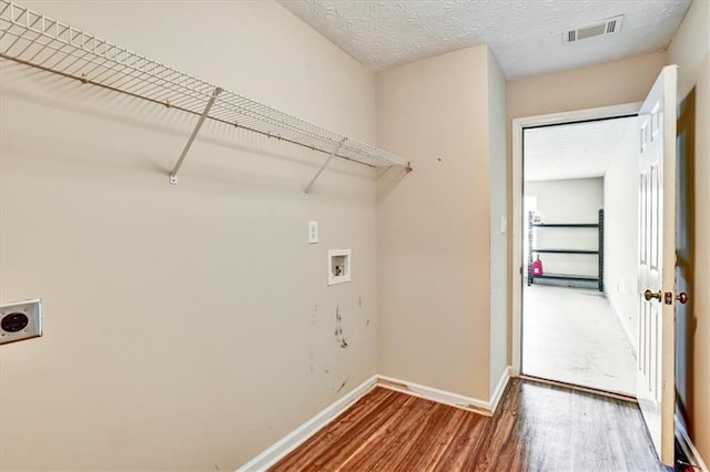 501 Barhams Ridge Dr, Mcdonough, GA 30252 - laundry area with visible vents, washer hookup, wood finished floors, electric dryer hookup, and laundry area