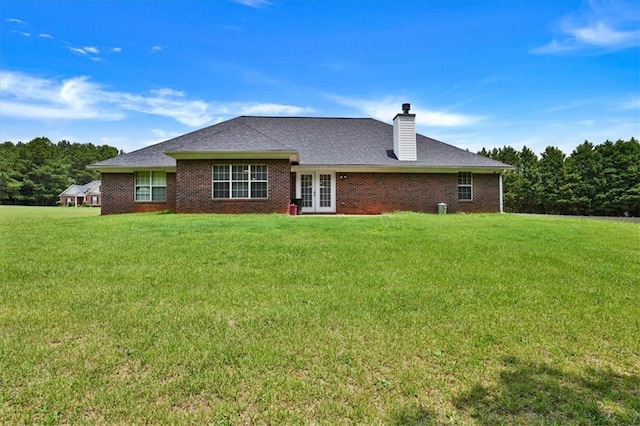 501 Barhams Ridge Dr, Mcdonough, GA 30252 - rear view of house featuring a chimney, french doors, and a yard