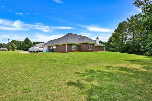 501 Barhams Ridge Dr, Mcdonough, GA 30252 - view of home's exterior featuring a lawn, a chimney, and brick siding