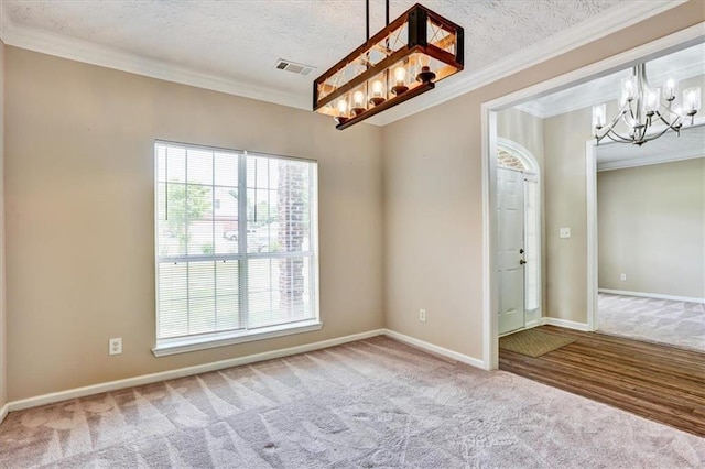 501 Barhams Ridge Dr, Mcdonough, GA 30252 - spare room featuring carpet, visible vents, crown molding, baseboards, and a notable chandelier