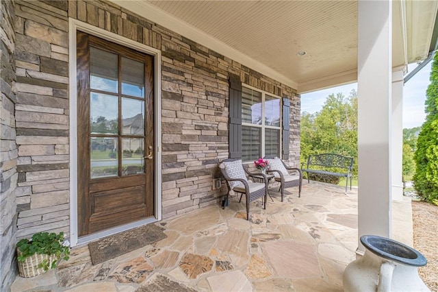 5960 Overlook Club Cir, Suwanee, GA 30024 - view of exterior entry featuring a porch and stone siding