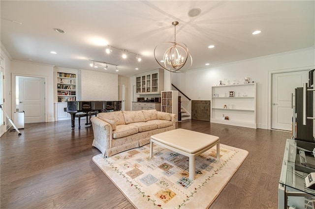 5960 Overlook Club Cir, Suwanee, GA 30024 - living area featuring stairs, a chandelier, built in features, crown molding, and dark wood-style flooring