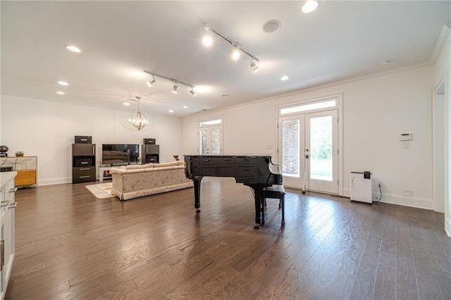 5960 Overlook Club Cir, Suwanee, GA 30024 - living area featuring french doors, ornamental molding, dark wood finished floors, a chandelier, and track lighting