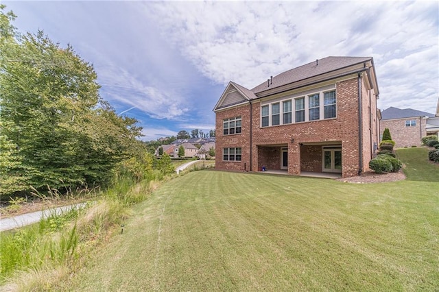 5960 Overlook Club Cir, Suwanee, GA 30024 - back of property with brick siding, a yard, a patio, and french doors