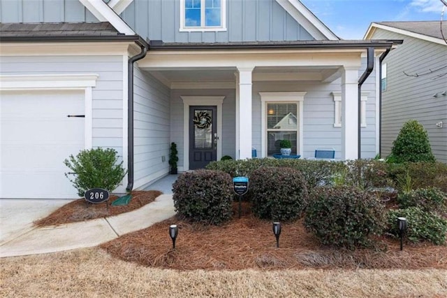 property entrance with a garage and a porch