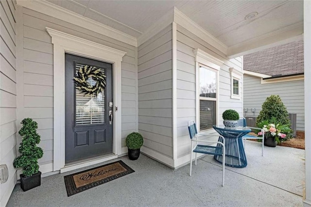 doorway to property with a porch