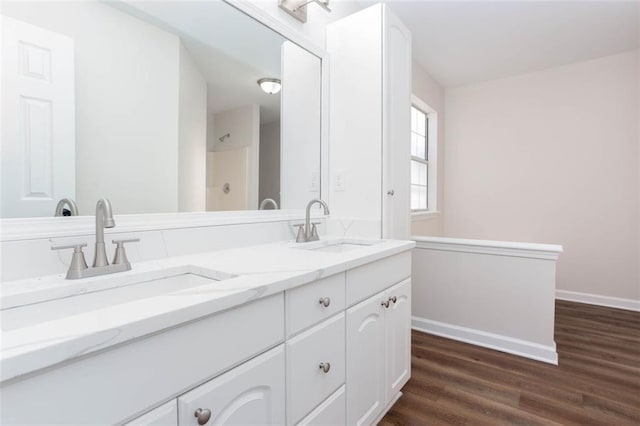 bathroom featuring vanity and hardwood / wood-style floors