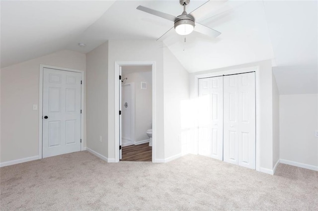 bonus room featuring ceiling fan, vaulted ceiling, and light carpet