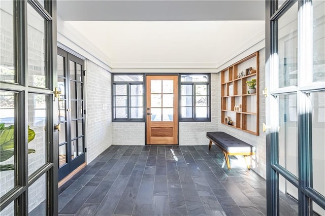 unfurnished sunroom with french doors