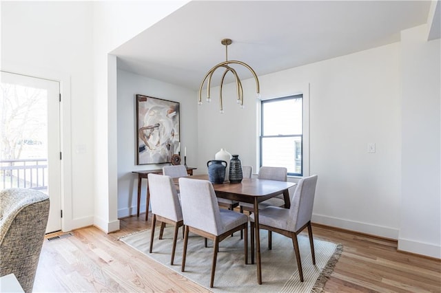 dining area with light hardwood / wood-style flooring