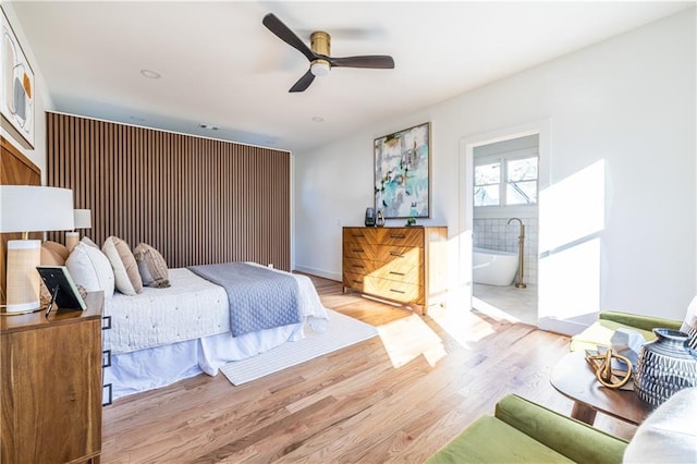 bedroom with ceiling fan and light hardwood / wood-style flooring