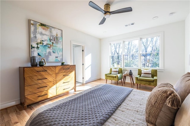 bedroom featuring ceiling fan and light hardwood / wood-style flooring