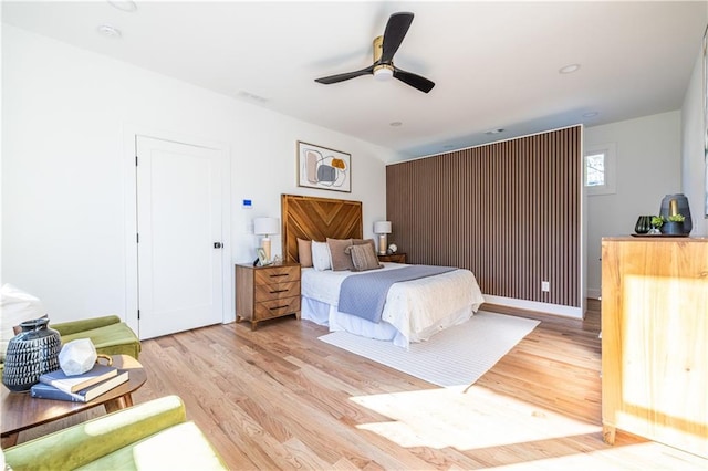 bedroom featuring ceiling fan and light hardwood / wood-style floors