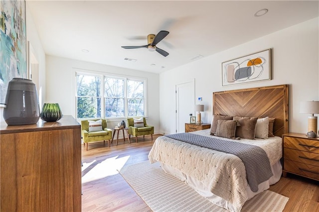 bedroom with light wood-type flooring and ceiling fan