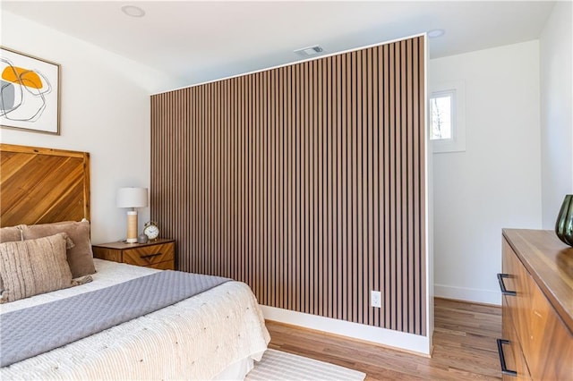 bedroom with light hardwood / wood-style floors