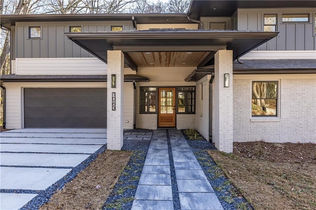 view of exterior entry featuring french doors and a garage