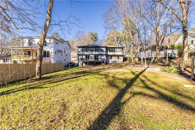 rear view of property with a lawn