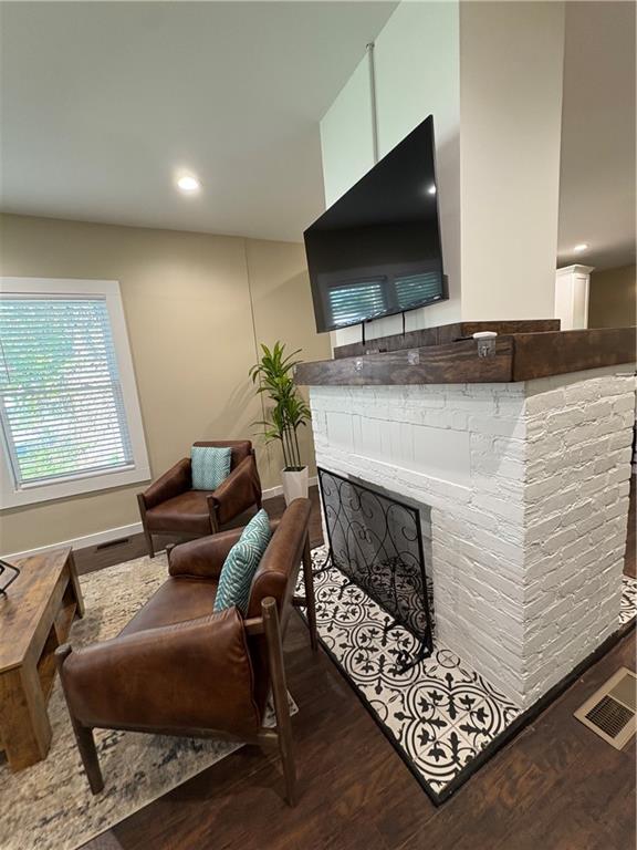 2148 Martin Luther King Jr Dr SW, Atlanta, GA 30310 - living room featuring wood finished floors, a fireplace, and recessed lighting