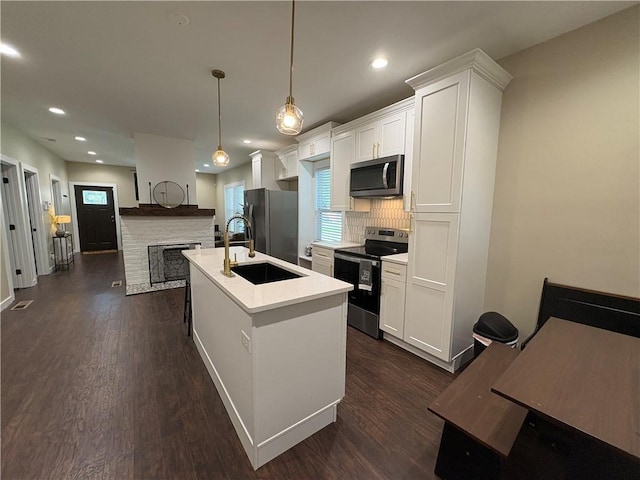 2148 Martin Luther King Jr Dr SW, Atlanta, GA 30310 - kitchen featuring stainless steel appliances, backsplash, light countertops, dark wood-style floors, and recessed lighting