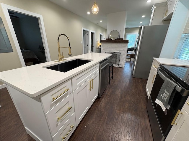 2148 Martin Luther King Jr Dr SW, Atlanta, GA 30310 - kitchen with stainless steel appliances, dark wood-type flooring, an island with sink, recessed lighting, and pendant lighting