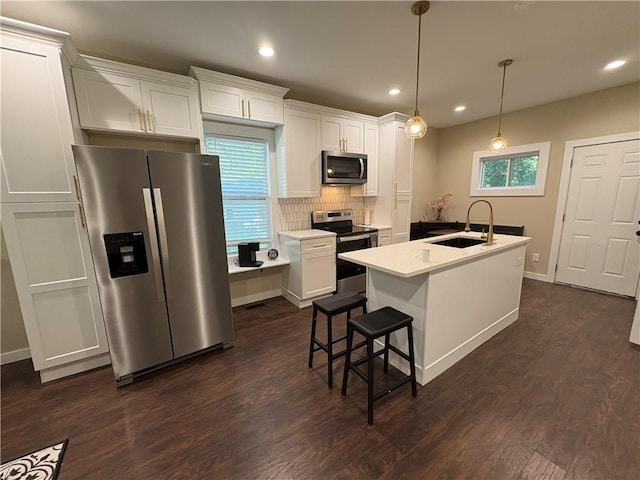 2148 Martin Luther King Jr Dr SW, Atlanta, GA 30310 - kitchen featuring appliances with stainless steel finishes, dark wood-style flooring, tasteful backsplash, white cabinets, and recessed lighting
