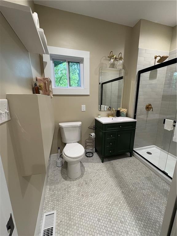 2148 Martin Luther King Jr Dr SW, Atlanta, GA 30310 - full bathroom featuring a shower stall, vanity, and tile patterned flooring