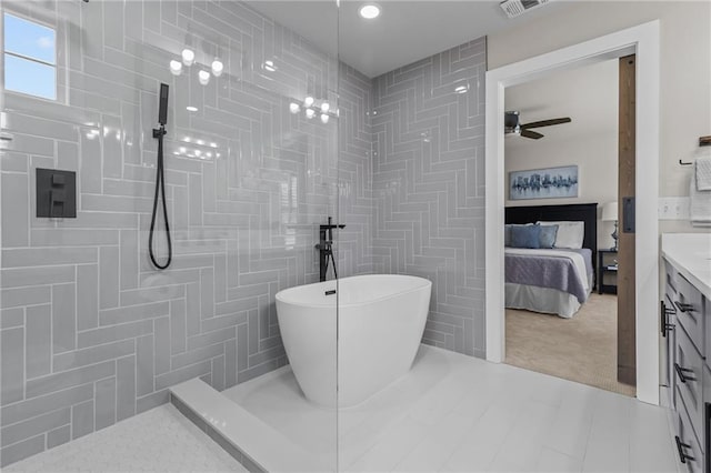 ensuite bathroom with a soaking tub, a ceiling fan, a walk in shower, vanity, and recessed lighting