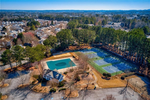 aerial view of property and surrounding area featuring a pool