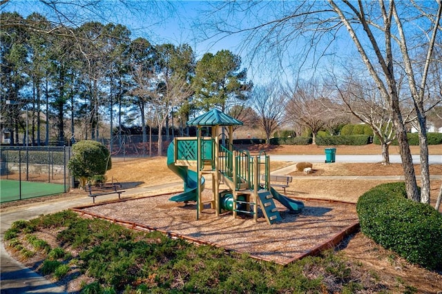 community jungle gym featuring fence