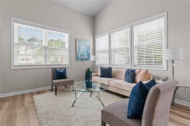 living room with wood finished floors and baseboards